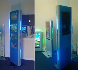 This 2 metre tall kiosk, comes with lower interactive 19'' display and a second, higher passive 19'' display for advertising purposes. At the rear of the unit a large passive of interactive third screen could replace the static advertisment area.